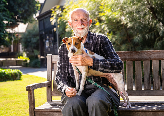 Squeak the dog with her new owner.